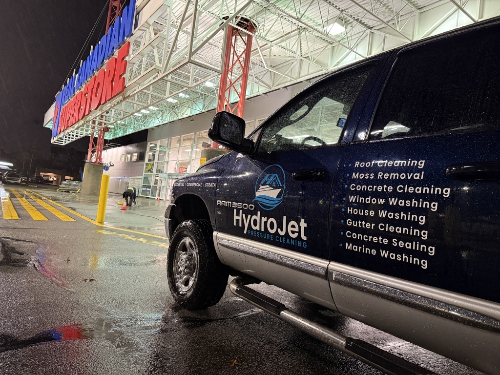 HydroJet service truck outside a Real Canadian Superstore at night